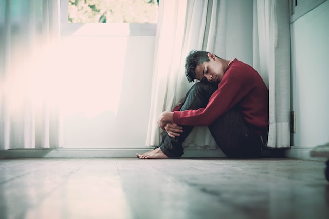 Boy sitting on the floor